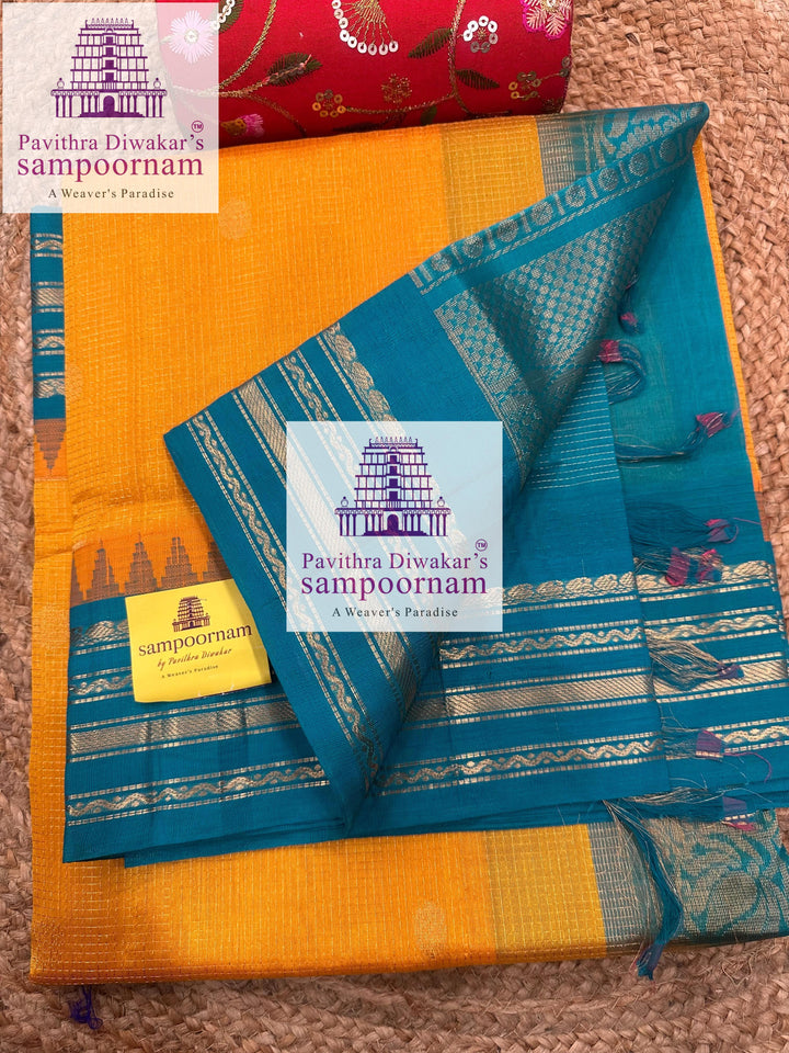 Mambazha Manjal with Turquoise Blue , rich zari Podi Kattam with butta in the body , temple traditional borders and rich  Pallu Korvai Silk Cotton Sare