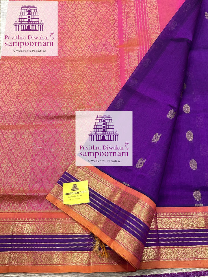 Purple with Peachish Pink , rich Zari butta in the body and Kanchi traditional borders and rich Pallu Korvai Silk Cotton Saree