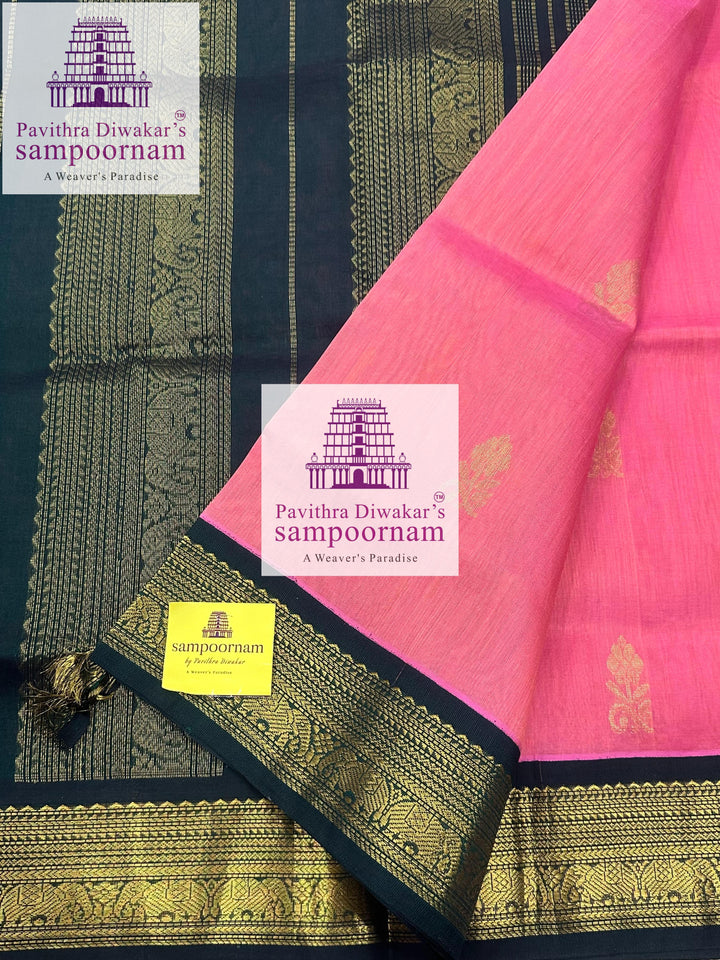 Peachish Pink with Dark Green , rich Zari butta in the body ,traditional boders and rich Pallu Korvai Silk Cotton Saree