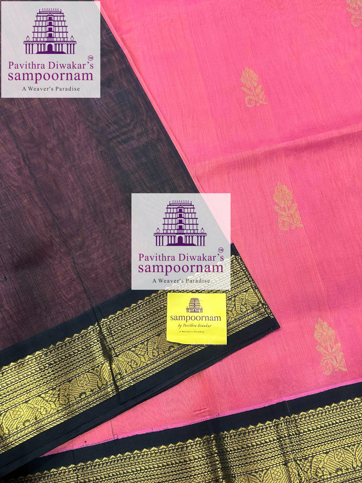 Peachish Pink with Dark Green , rich Zari butta in the body ,traditional boders and rich Pallu Korvai Silk Cotton Saree
