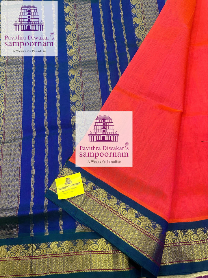 Dark Orangish Pink with Mayilkazhuthu , rich Zari butta in the body , traditional borders and rich Pallu Korvai Silk Cotton Saree