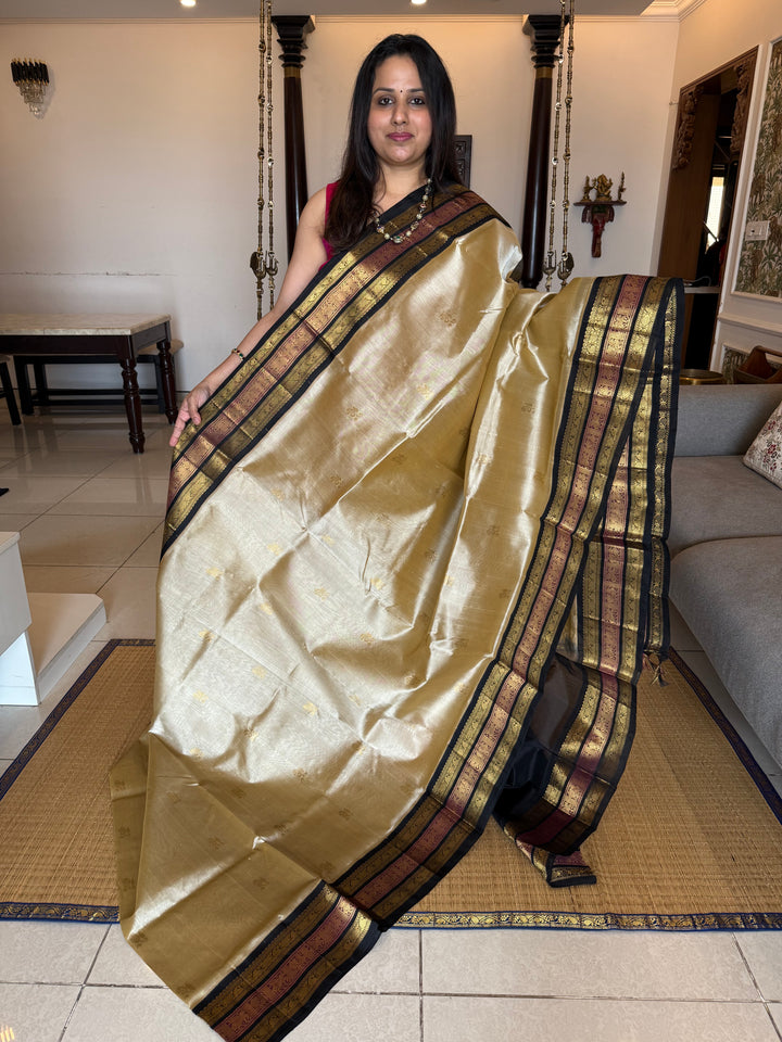 Gold with Black colour Rich Zari Butta in the body , Kanchi border and rich pallu Korvai Silk Cotton Saree