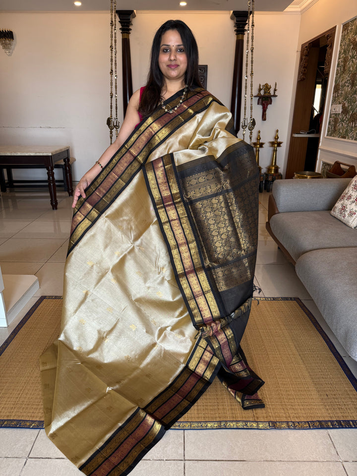 Gold with Black colour Rich Zari Butta in the body , Kanchi border and rich pallu Korvai Silk Cotton Saree