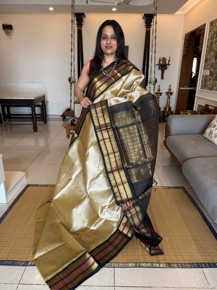 Gold with Black colour Rich Zari Butta in the body , Kanchi border and rich pallu Korvai Silk Cotton Saree
