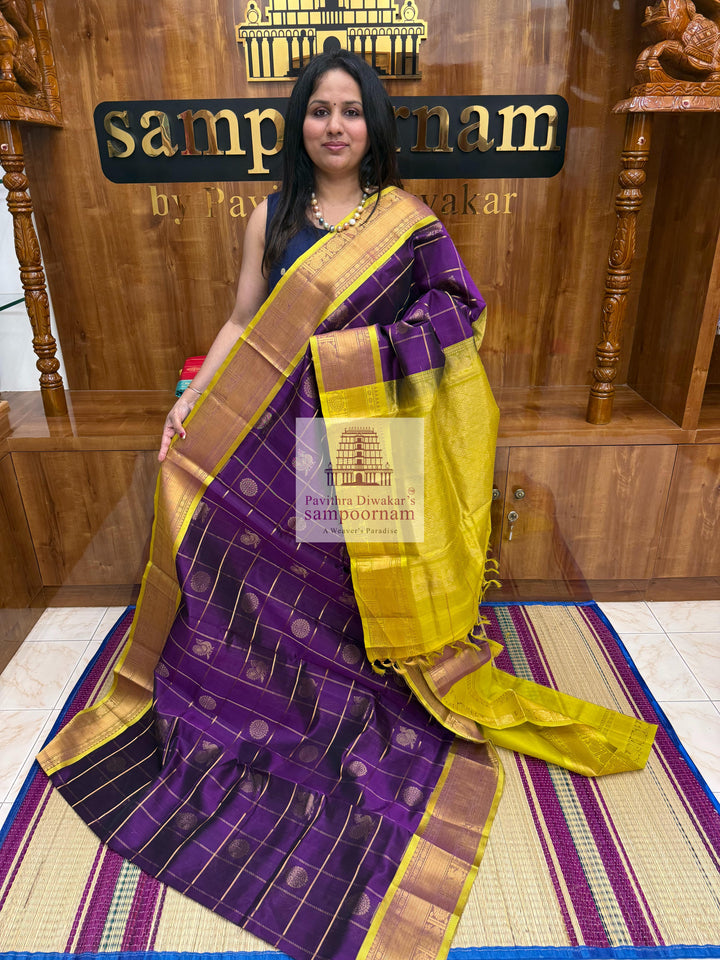 Purple with Lemon Yellow , , rich Zari checks in the body , Mayil and Chakram rich Zari butta in the body , traditional borders and rich Pallu Silk Cotton Saree