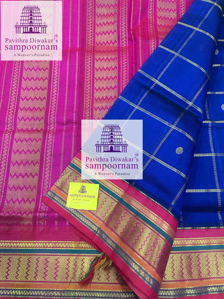 Blue with Pink , Zari checks in the body , rich Zari butta , traditional borders and rich Pallu Korvai Silk Cotton Saree