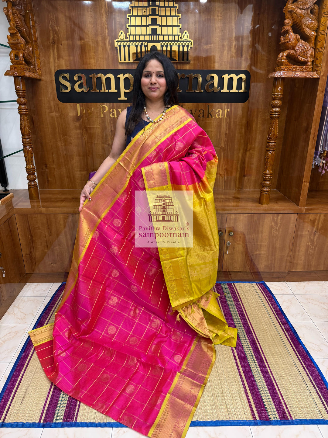 Rani pink with Lemon Yellow, , rich Zari checks in the body , Mayil and Chakram rich Zari butta in the body , traditional borders and rich Pallu Silk Cotton Saree