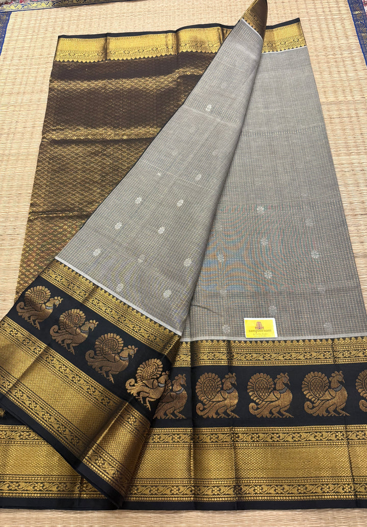 Grey with Black zari podi kattam in the body,satin border with annam motif, rich border and pallu korvai silk  cotton saree