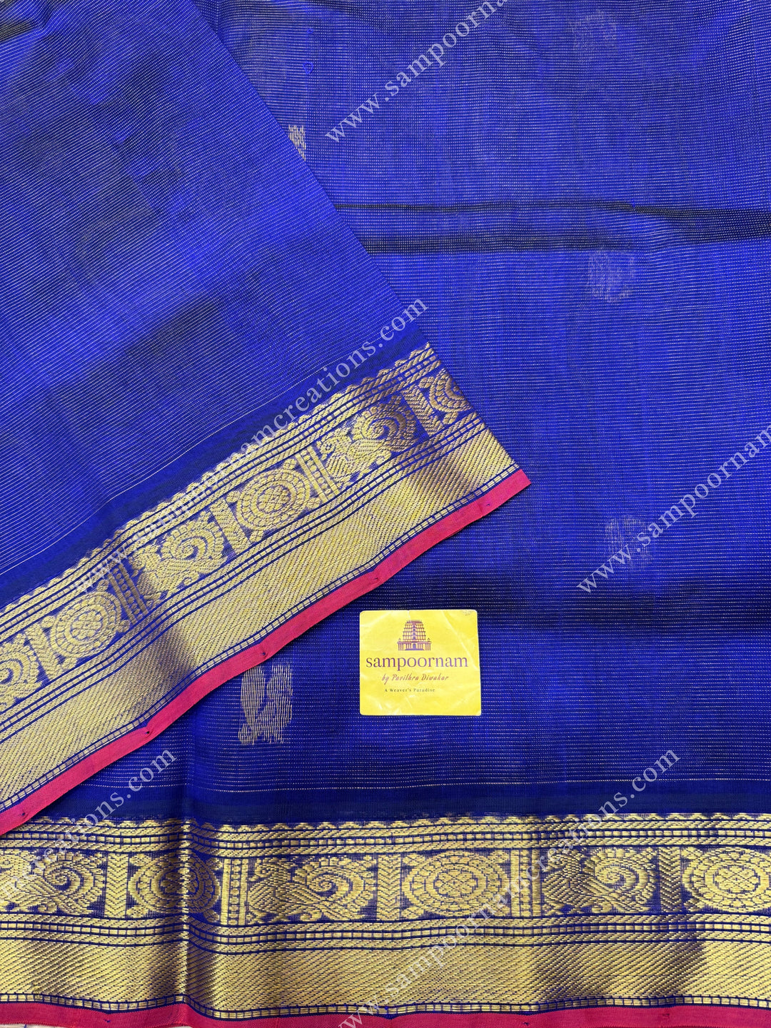 Blue , Red Selvedge  , Zari butta in the body with  Vairaoosi Zari lines , traditional borders  and rich Pallu Silk Cotton Saree