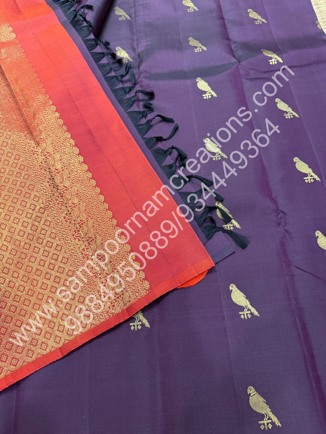 Dark Jamun with Rust Orange , Rich Parrot Zari  butta in the body  and  a Rich Pallu , Pure Kanjivaram Silk Saree