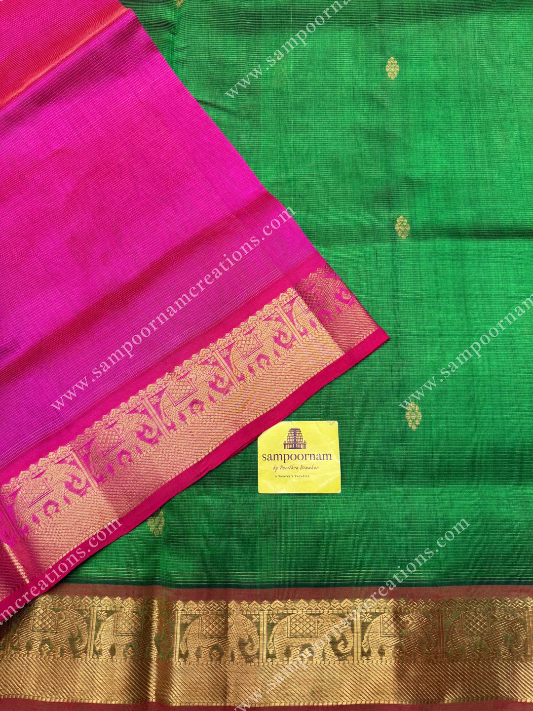 Parrot Green with Pink  , Zari butta in the body with  Vairaoosi Zari lines , traditional borders  and rich Pallu Silk Cotton Saree
