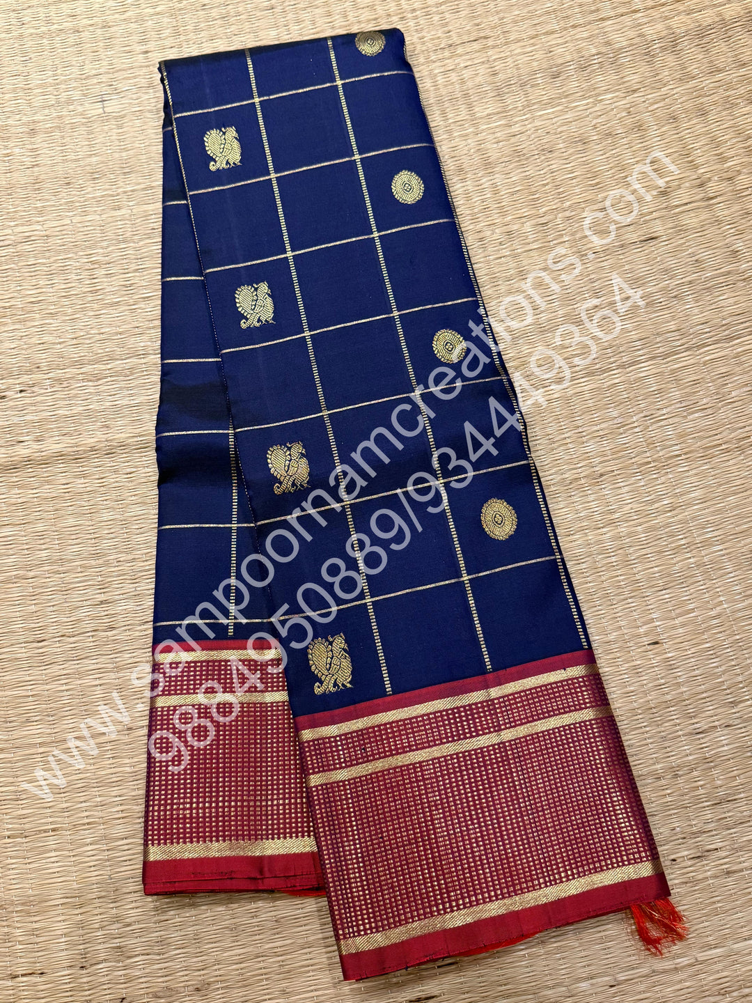 Dark Blue with Mauve , Rich Mayil and Chakram  butta in the body with Zari checks , Traditional borders and Rich Pallu , Pure Kanjivaram Silk Saree