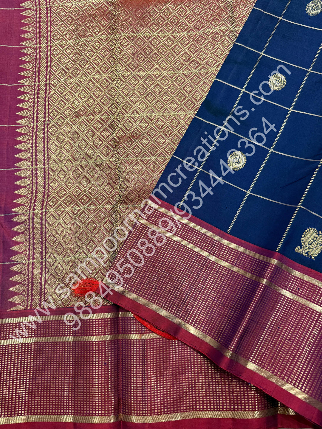 Dark Blue with Mauve , Rich Mayil and Chakram  butta in the body with Zari checks , Traditional borders and Rich Pallu , Pure Kanjivaram Silk Saree