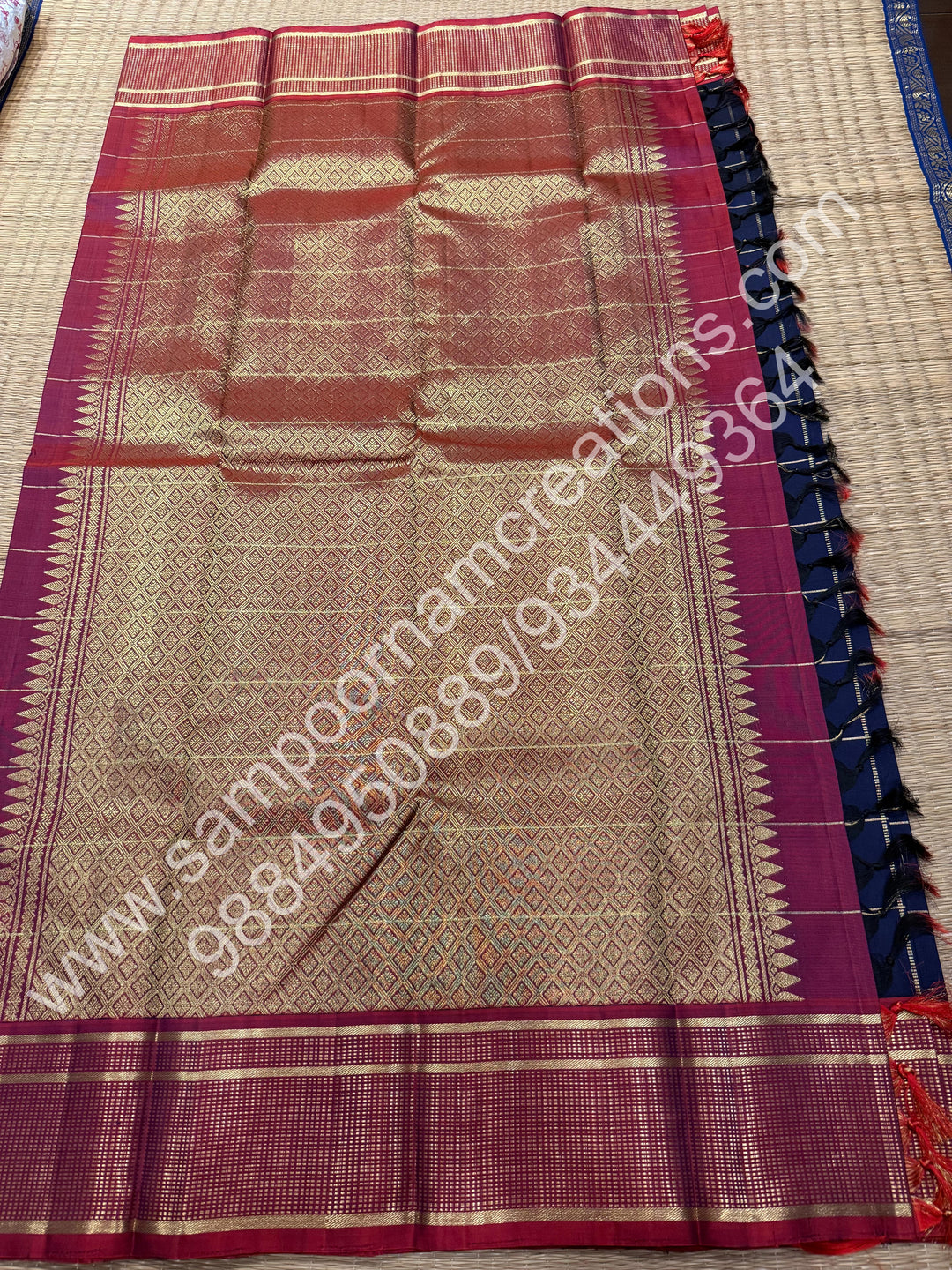 Dark Blue with Mauve , Rich Mayil and Chakram  butta in the body with Zari checks , Traditional borders and Rich Pallu , Pure Kanjivaram Silk Saree
