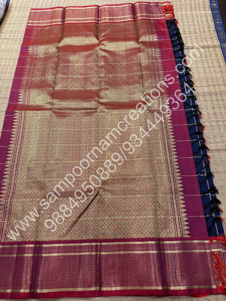 Dark Blue with Mauve , Rich Mayil and Chakram  butta in the body with Zari checks , Traditional borders and Rich Pallu , Pure Kanjivaram Silk Saree