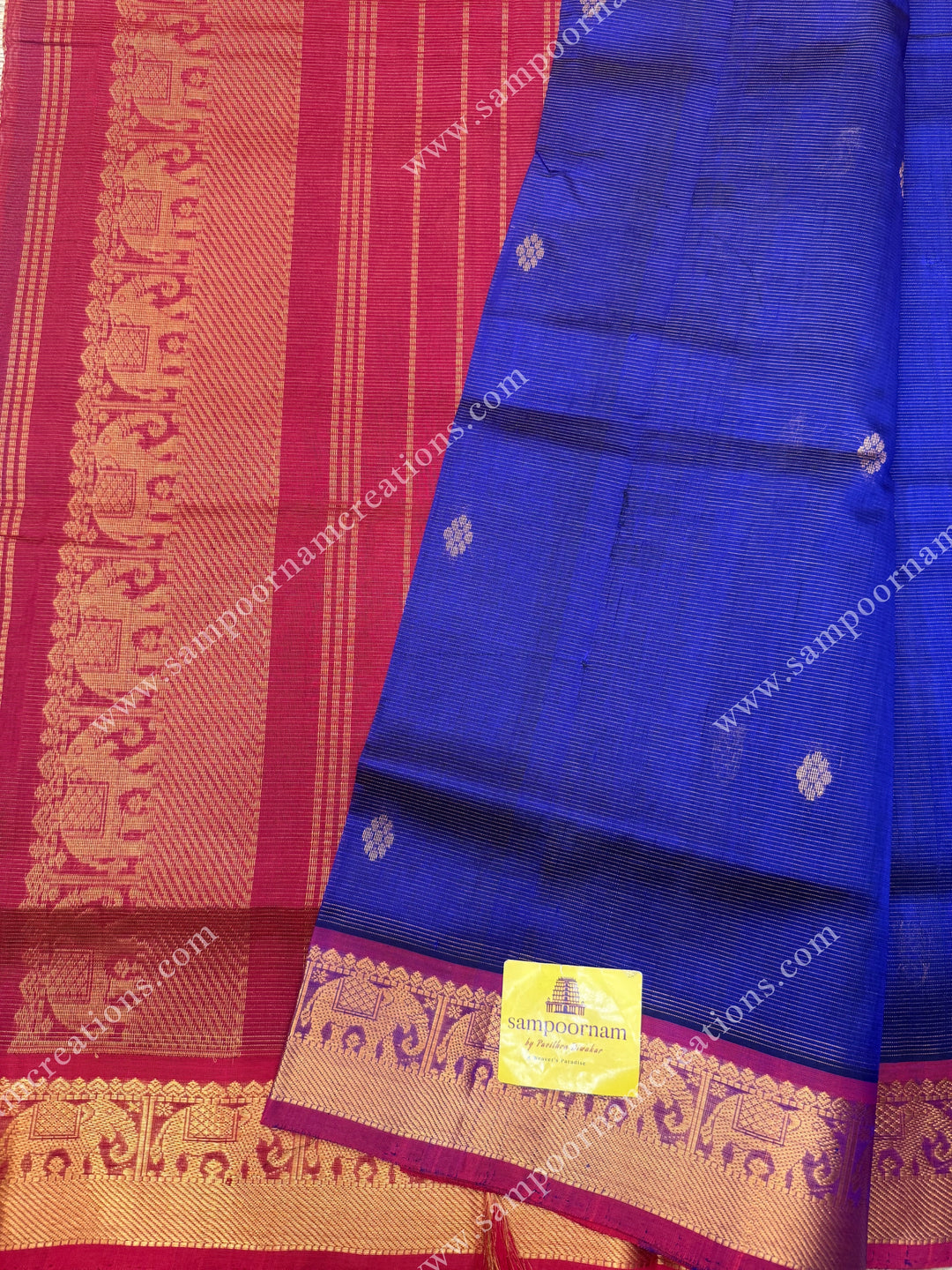 Blue with Red  , Zari butta in the body with  Vairaoosi Zari lines , traditional borders  and rich Pallu Silk Cotton Saree