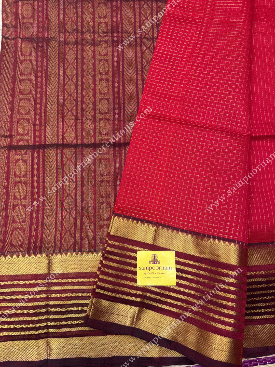Red with Arakku , Zari checks in the body and One side long veldhari borders , rich Pallu Silk Cotton Saree