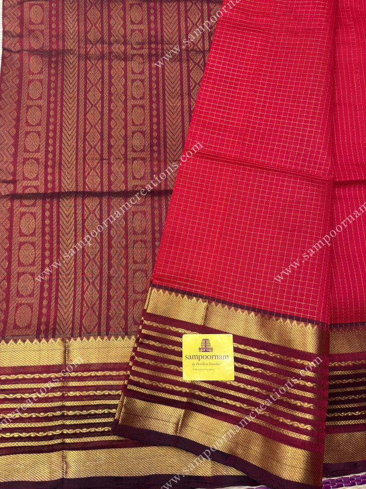 Red with Arakku , Zari checks in the body and One side long veldhari borders , rich Pallu Silk Cotton Saree