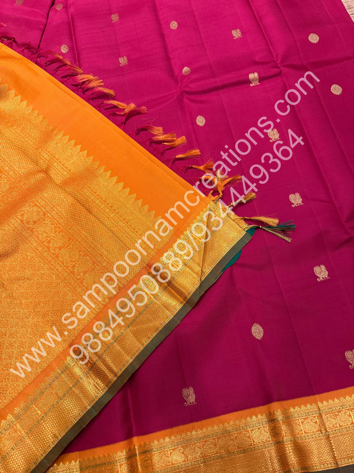 Kumkum Red with Mustard , Rich Mayil and Chakram  butta in the body , Traditional borders and Rich Pallu , Pure Kanjivaram Silk Saree
