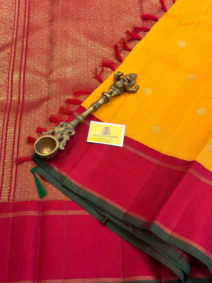 A Must Have Two Pallu Concept Ganga Jamuna Red/Green ,Mambazha Manjal Colour with Chakram Butta Traditional Kanjivaram Pure Silk Saree.Pure Zari Pure Silk