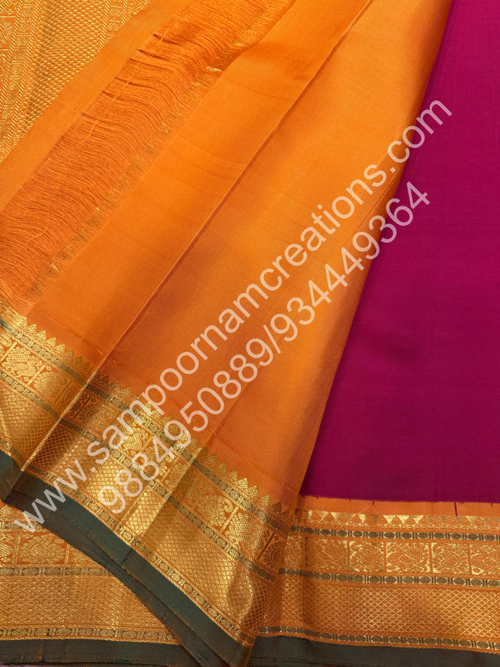 Kumkum Red with Mustard , Rich Mayil and Chakram  butta in the body , Traditional borders and Rich Pallu , Pure Kanjivaram Silk Saree