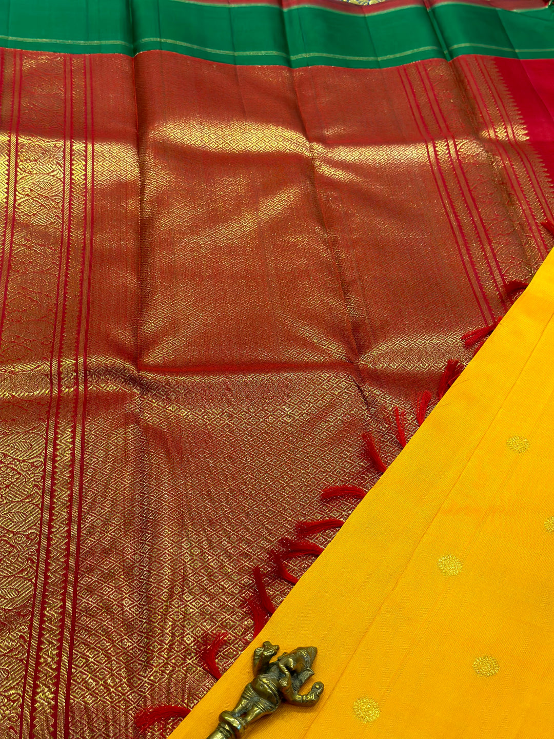 A Must Have Two Pallu Concept Ganga Jamuna Red/Green ,Mambazha Manjal Colour with Chakram Butta Traditional Kanjivaram Pure Silk Saree.Pure Zari Pure Silk