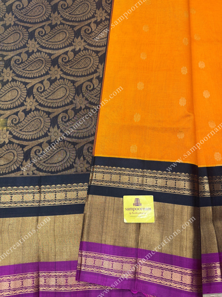 Rustic Orange with Black , Rich Floral  Zari Butta in the body and One side big triple  border ,  grand Pallu Korvai Silk Cotton Saree