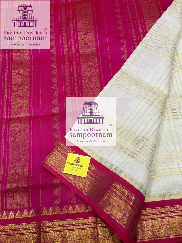 White with Pink , Zari lines in the body ,traditional borders and rich  Pallu Korvai Silk Cotton Saree