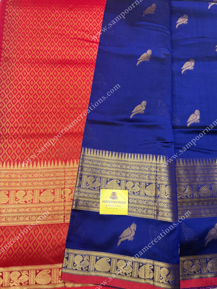 Blue with Red , Zari Parrot motif in the body and  One side big rettapet border , grand Pallu Silk Cotton Saree