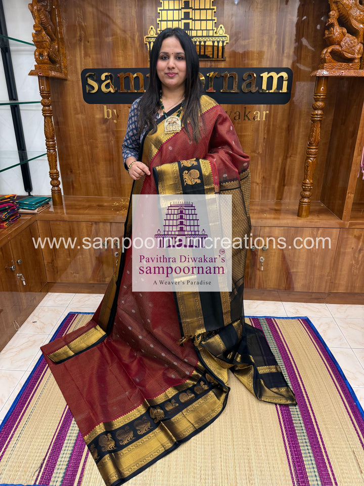 Maroon with Black ,  Zari Podi Kattam in the body , one side big Satin border with Annam motif , traditional border and rich Pallu Korvai Silk Cotton Saree