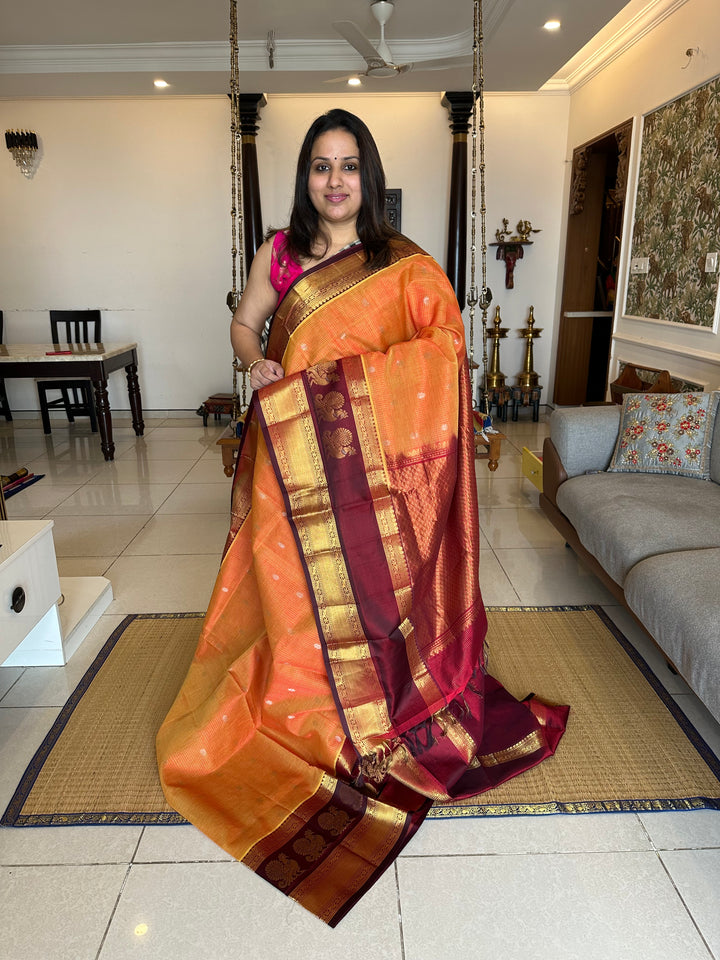 Orange with Araku Podi Kattam with Silver Butta in The Body and Satin Peacock Motif Border and Rich Pallu Korvai Silk Cotton Saree