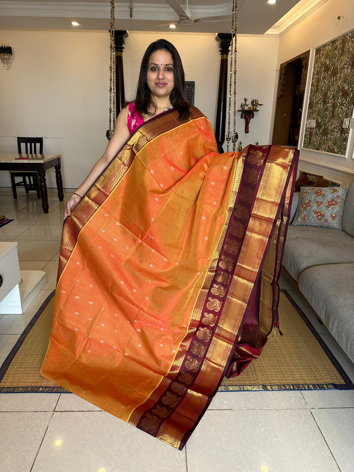 Orange with Araku Podi Kattam with Silver Butta in The Body and Satin Peacock Motif Border and Rich Pallu Korvai Silk Cotton Saree