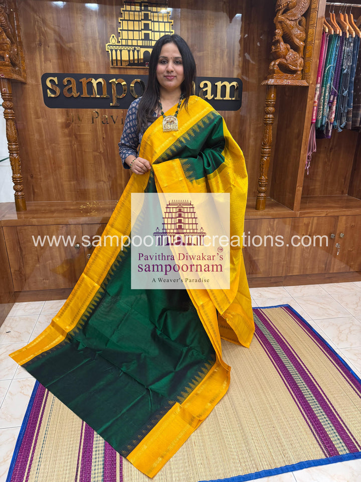 Dark Green with Manjal , temple rettapet border , grand Pallu Korvai Silk Cotton Saree