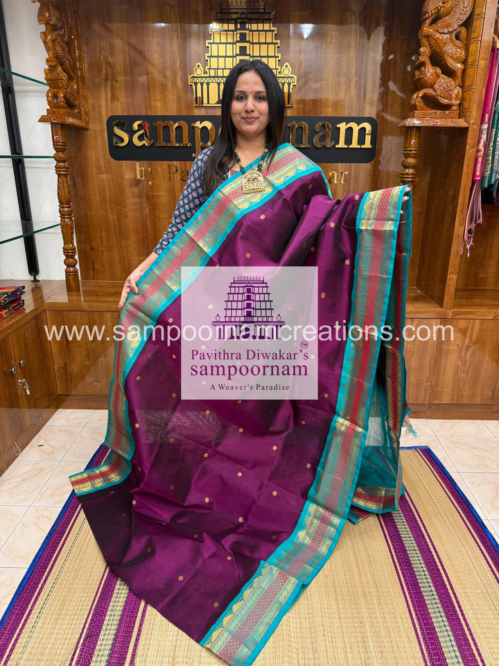 Purple with Blue ,rich Zari butta in the body, traditional borders and rich  , rich Zari butta in the body and Kanchi traditional borders and rich Pallu Korvai Silk Cotton Sare