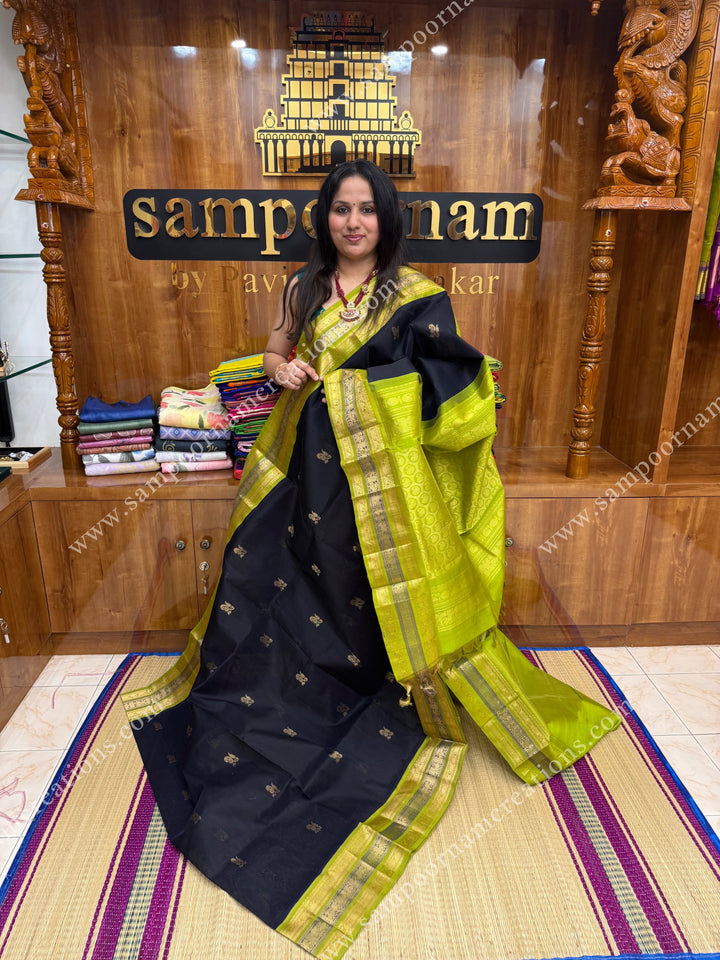 Black with Lemon Green  , Rich Zari butta in the body and Kanchi  borders , grand Pallu Korvai Silk Cotton Saree