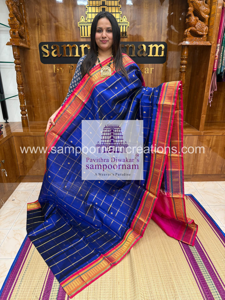 Blue with Pink , Zari checks in the body , rich Zari butta , traditional borders and rich Pallu Korvai Silk Cotton Saree