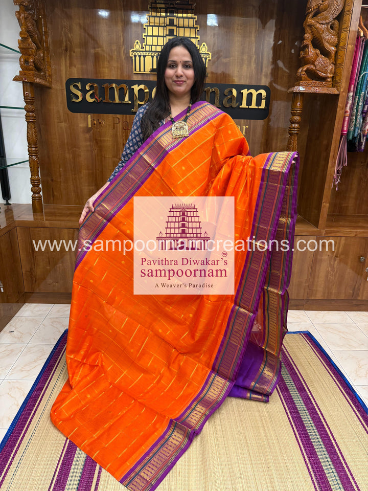 Orange with Purple , rich Zari butta , traditional borders and rich Pallu Korvai Silk Cotton Saree
