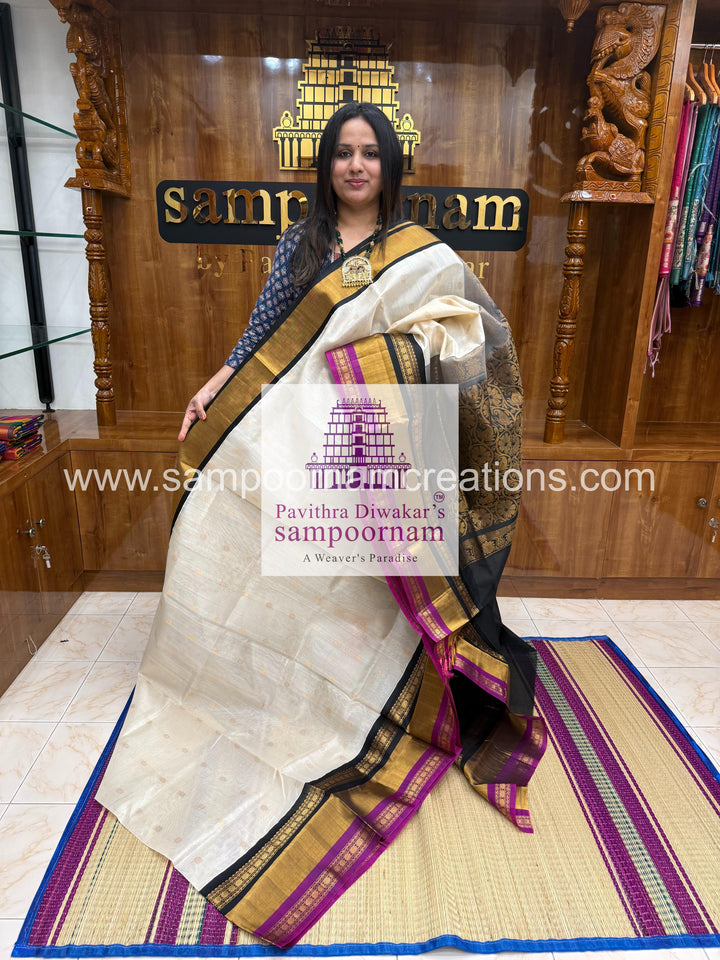 White with Black , triple one side big border , rich butta in the body and grand Pallu Korvai Silk Cotton Saree