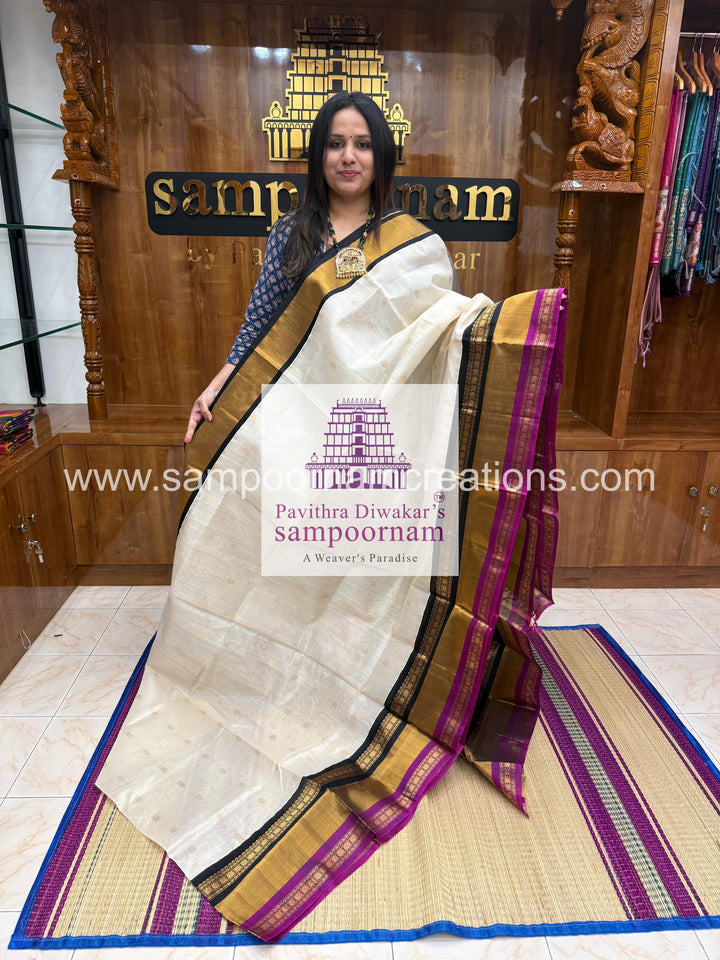 White with Black , triple one side big border , rich butta in the body and grand Pallu Korvai Silk Cotton Saree