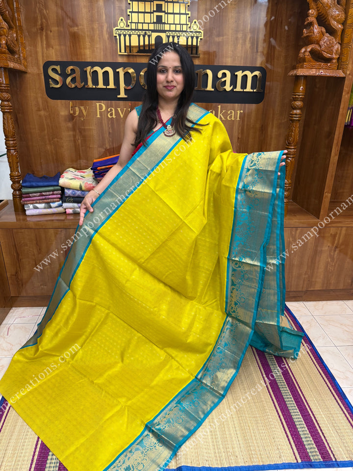 Lemon Yellow with Turquoise Blue ,  Rich Zari butta and Podi Kattam in the body , traditional One side long border , grand Pallu Korvai Silk Cotton Saree
