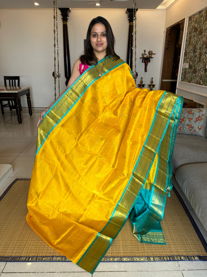 Yellow with Turquoise Blue Mayil Chakram Silk Cotton Saree