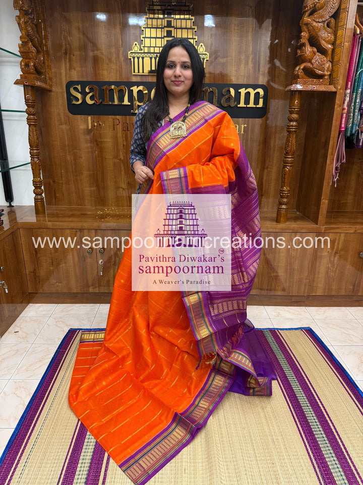 Orange with Purple , rich Zari butta , traditional borders and rich Pallu Korvai Silk Cotton Saree