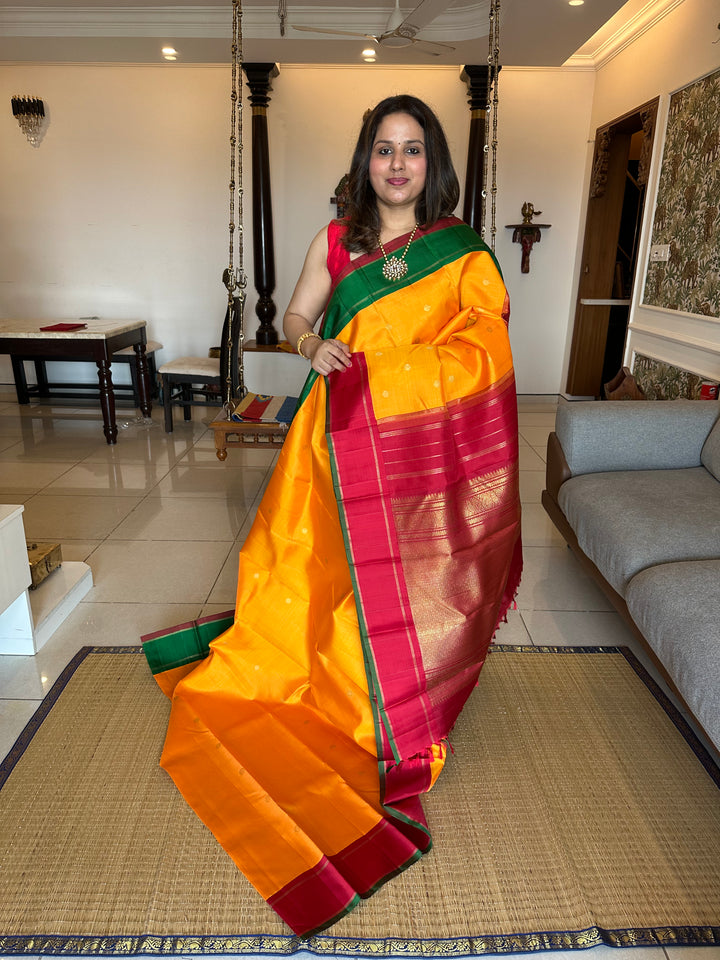 A Must Have Two Pallu Concept Ganga Jamuna Red/Green ,Mambazha Manjal Colour with Chakram Butta Traditional Kanjivaram Pure Silk Saree.Pure Zari Pure Silk