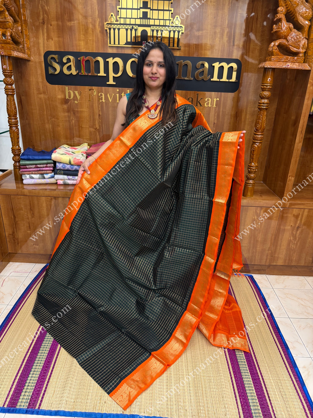 Dark Green with Orange , Rich Zari checks in the body , traditional borders , grand Pallu Korvai Silk Cotton Saree