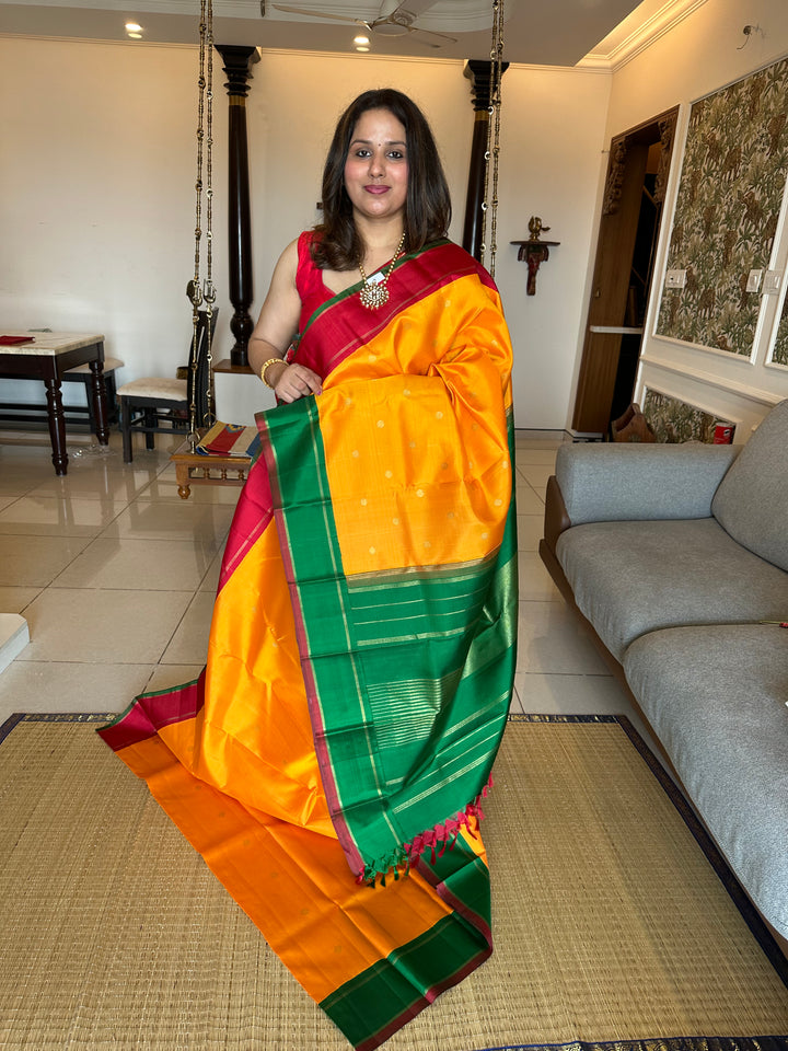 A Must Have Two Pallu Concept Ganga Jamuna Red/Green ,Mambazha Manjal Colour with Chakram Butta Traditional Kanjivaram Pure Silk Saree.Pure Zari Pure Silk