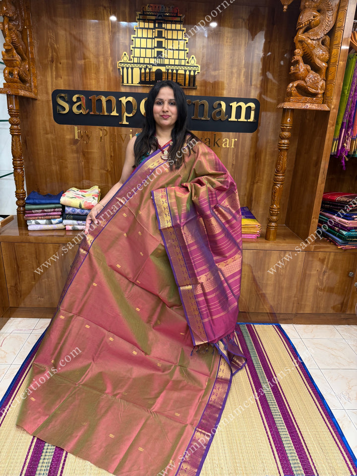 Double Shaded magenta and green , Zari butta in the body with  Vairaoosi Zari lines , traditional borders  and rich Pallu Silk Cotton Saree