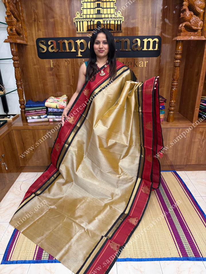 Beige with Black   ,  Elephant motifs in the borders and  Traditional  Pallu Korvai Silk Cotton Saree