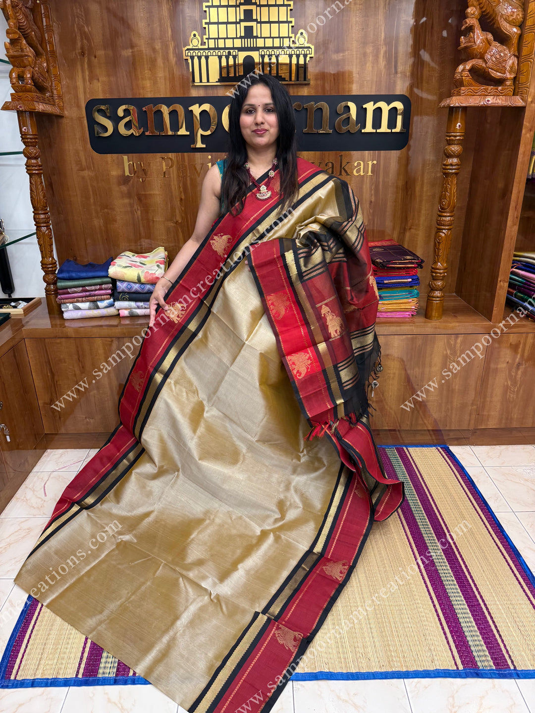Beige with Black   ,  Elephant motifs in the borders and  Traditional  Pallu Korvai Silk Cotton Saree