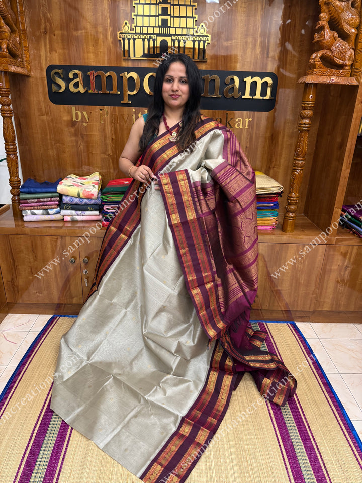Grey with Dark Maroon , Rich Zari butta in the body and rettapet borders , grand Pallu Korvai Silk Cotton Saree