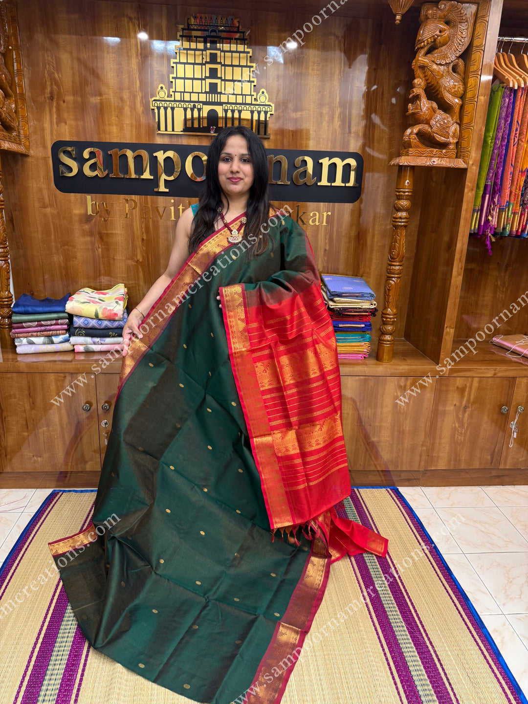 Green with Red , Zari butta in the body with  Vairaoosi Zari lines , traditional borders  and rich Pallu Silk Cotton Saree